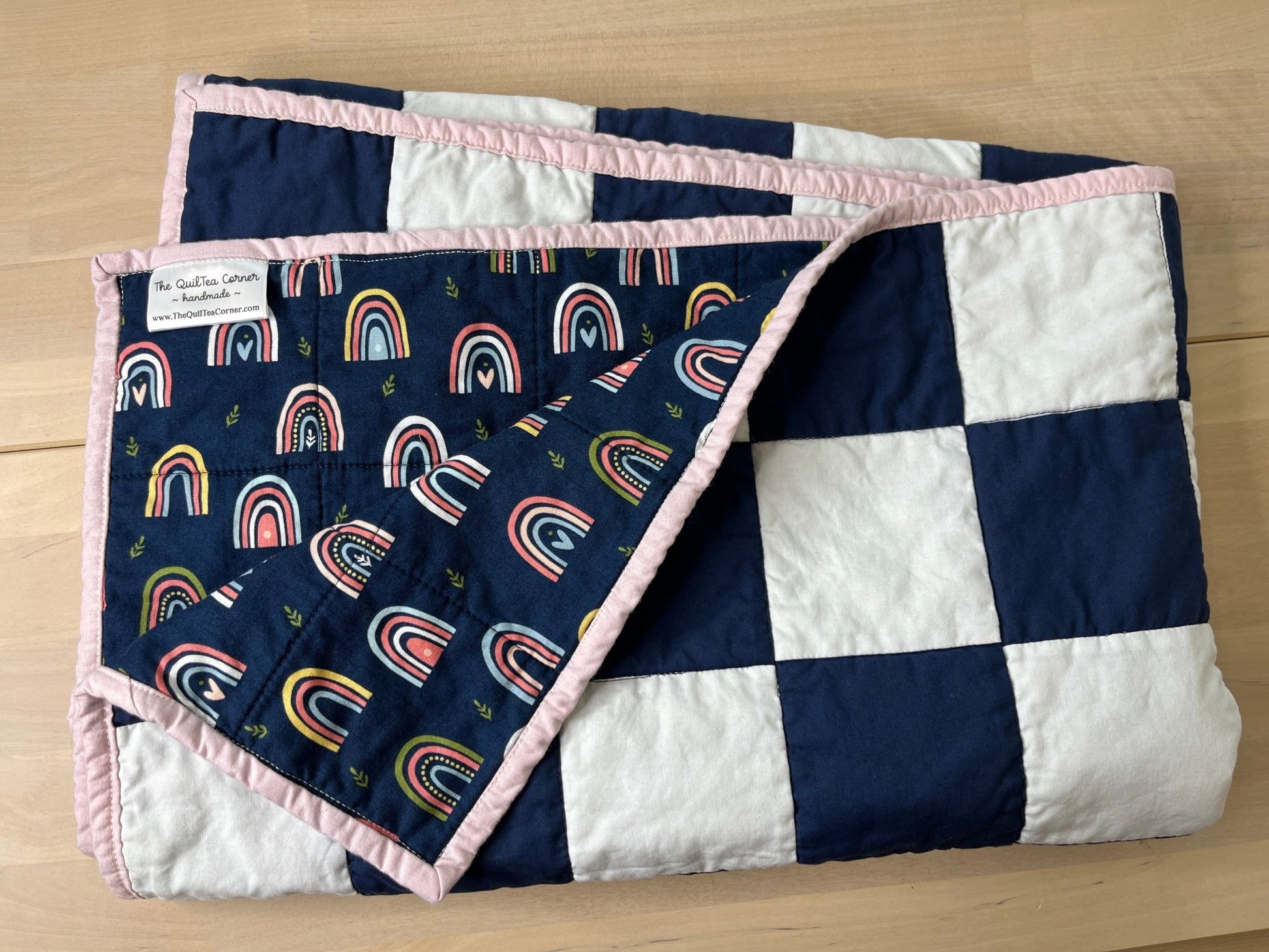 Navy White Checkered Modern Baby Crib Quilt with Boho Rainbow Fabric Backing - The QuilTea Corner