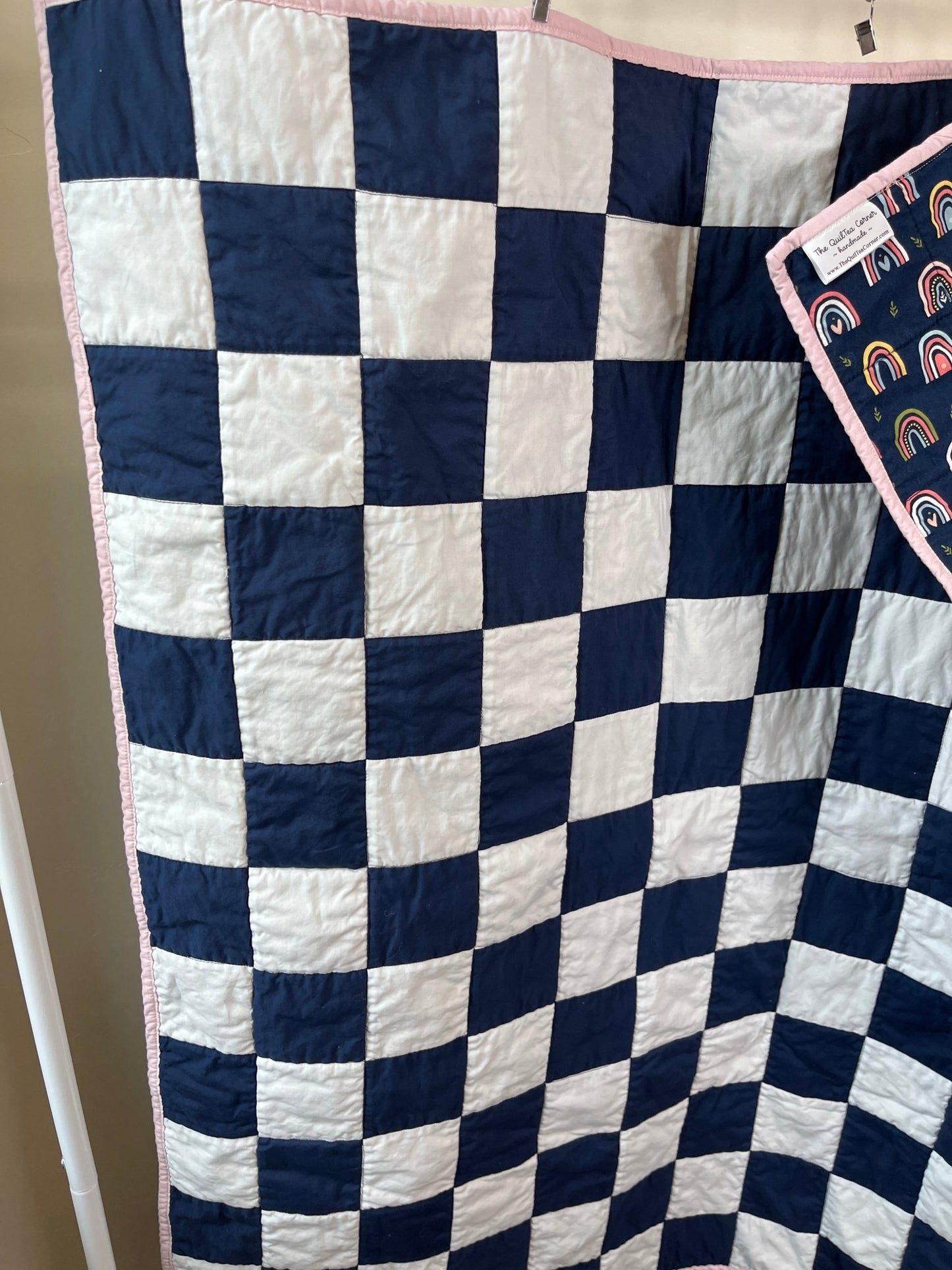 Navy White Checkered Modern Baby Crib Quilt with Boho Rainbow Fabric Backing - The QuilTea Corner