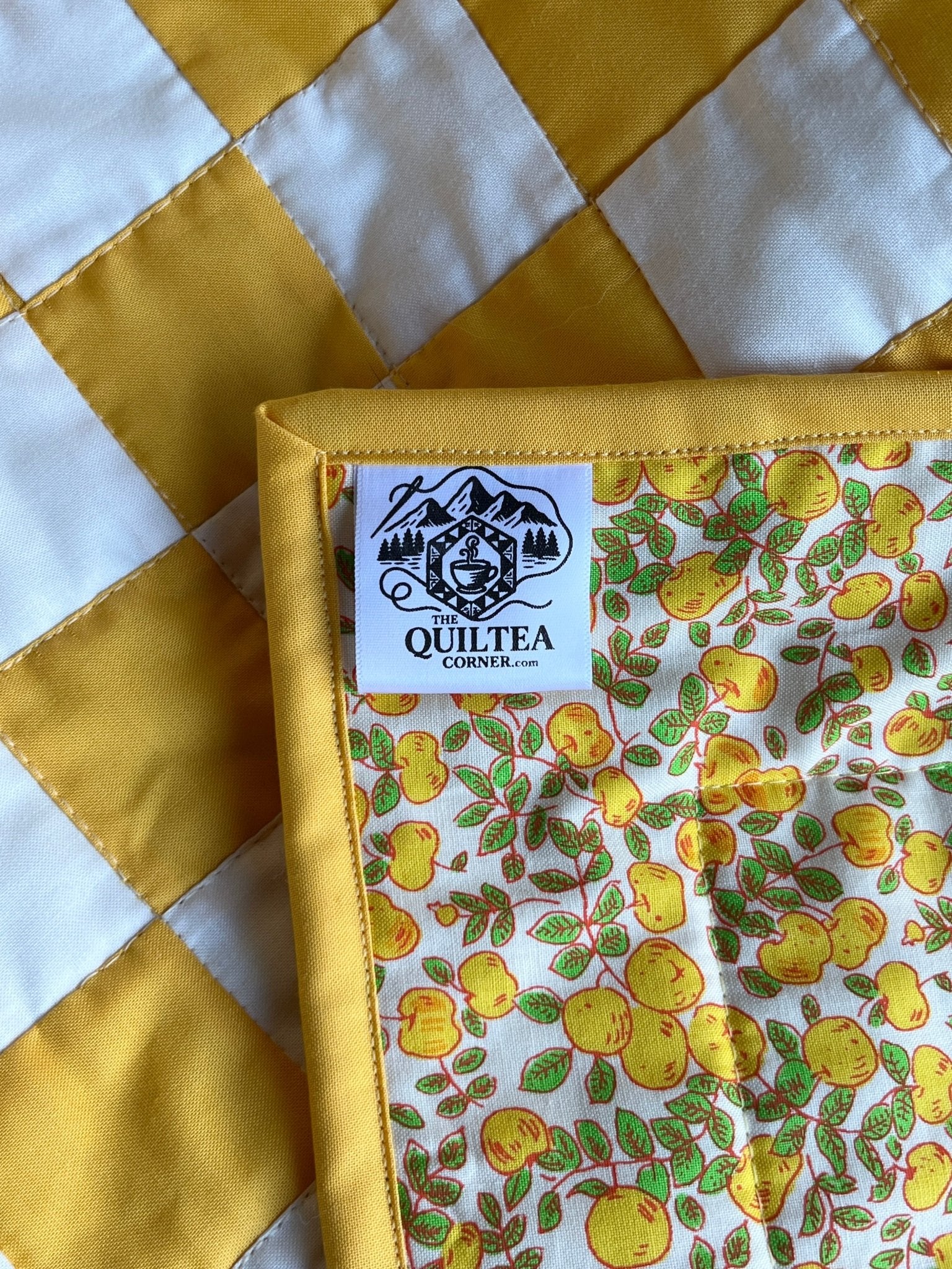 Yellow Checkered Baby Quilt – Handmade Checkerboard Crib Blanket – Heather Ross Apples Fabric - The QuilTea Corner